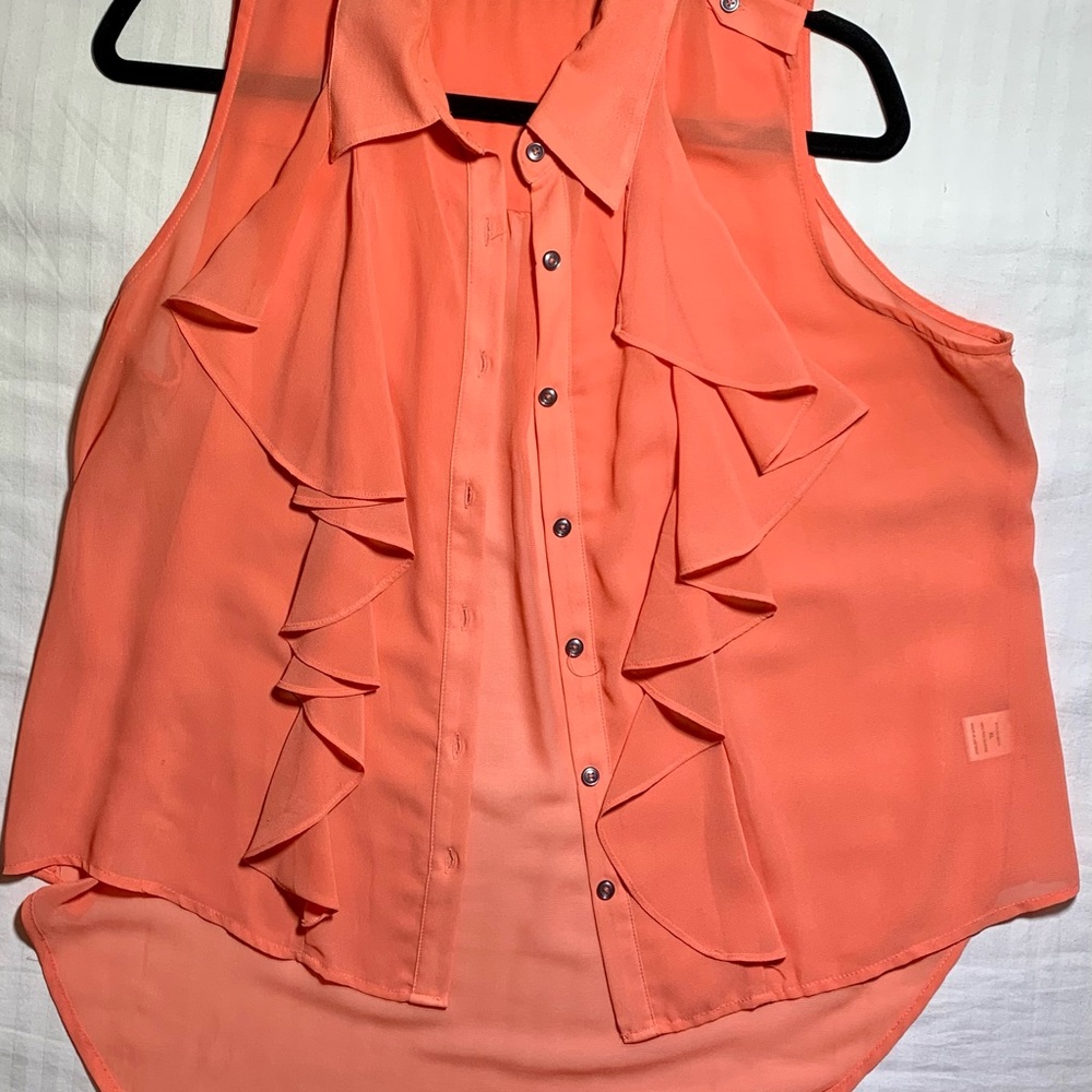 Have sleeveless sheer top